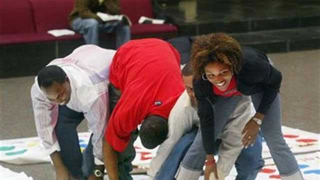FILE - Twister game being played in Edwardsville, Ill. on Sept. 22, 2004.