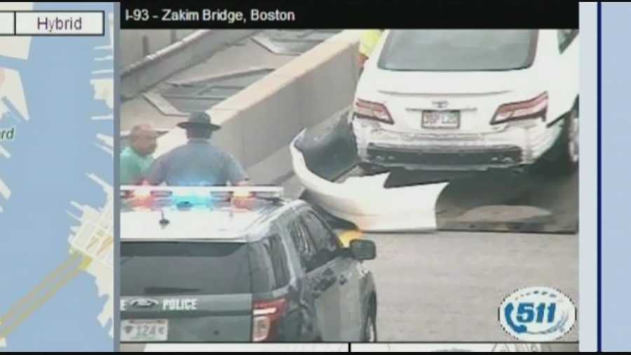 A massive-sized American Flag came tumbling down from Boston's Zakim Bridge Friday, causing one driver to crash into another.