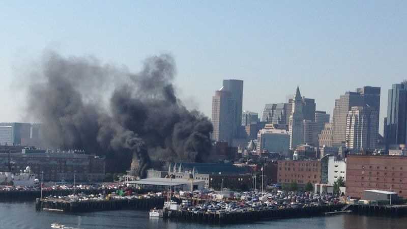 A fire inside a three-story warehouse at the Boston Coast Guard station caused smoke to fill the nearby neighborhood. 