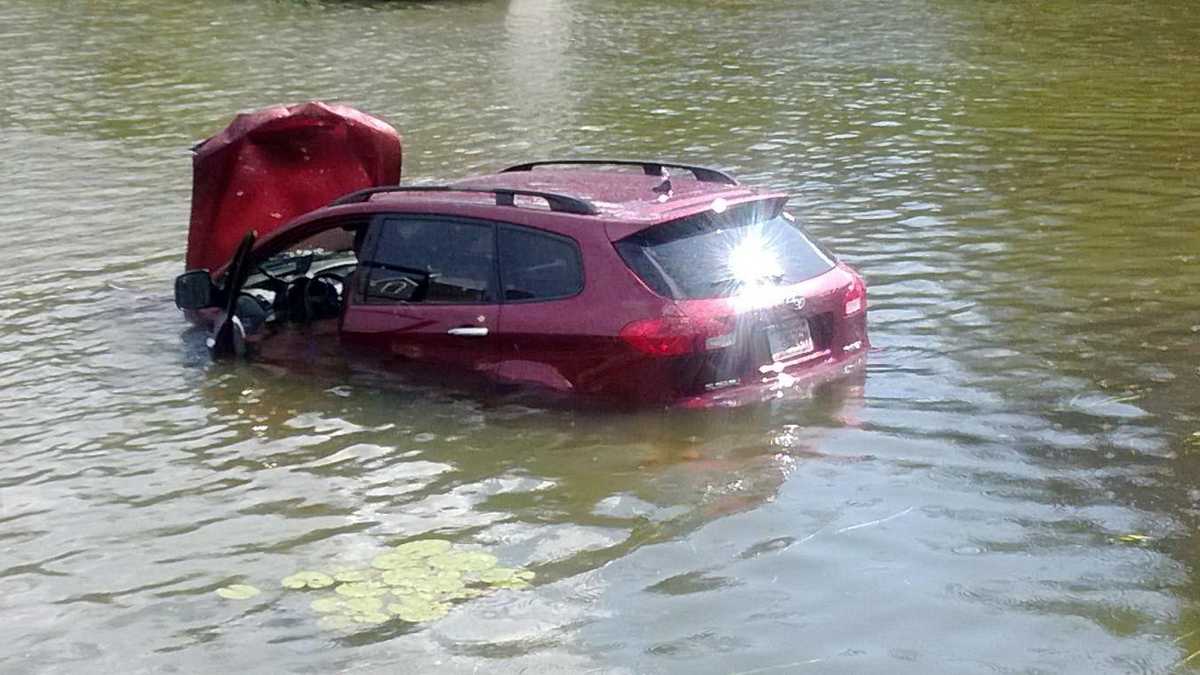 Driver rescued from vehicle submerged in pond