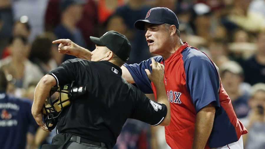Home plate umpire Jerry Meals, left, ejects Boston Red Sox manager John Farrell in the eighth inning of a baseball game against the Tampa Bay Rays in Boston, Monday, July 29, 2013. The Rays won 2-1. 
