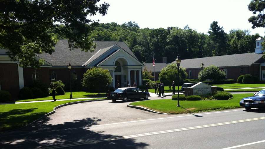 Mourners gather for Lord's funeral in Wilbraham. 