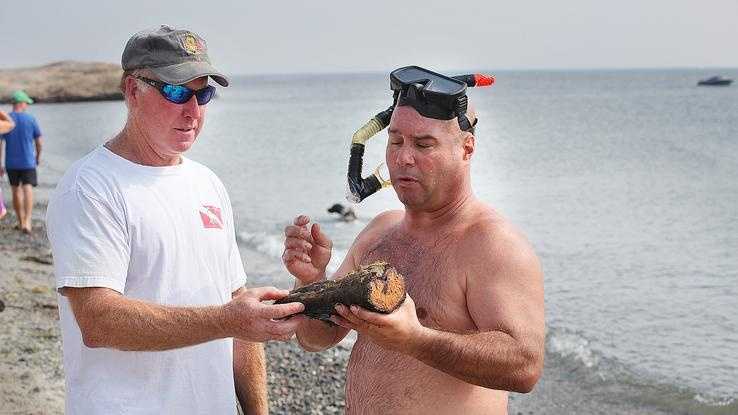 Diver Dan Chiasson, of Scituate discovered two wrecked barges off Minot Beach in Scituate.Tom Mulloy, also a diver from Scituate, helps him identify the pieces,Saturday, July 20,2013.