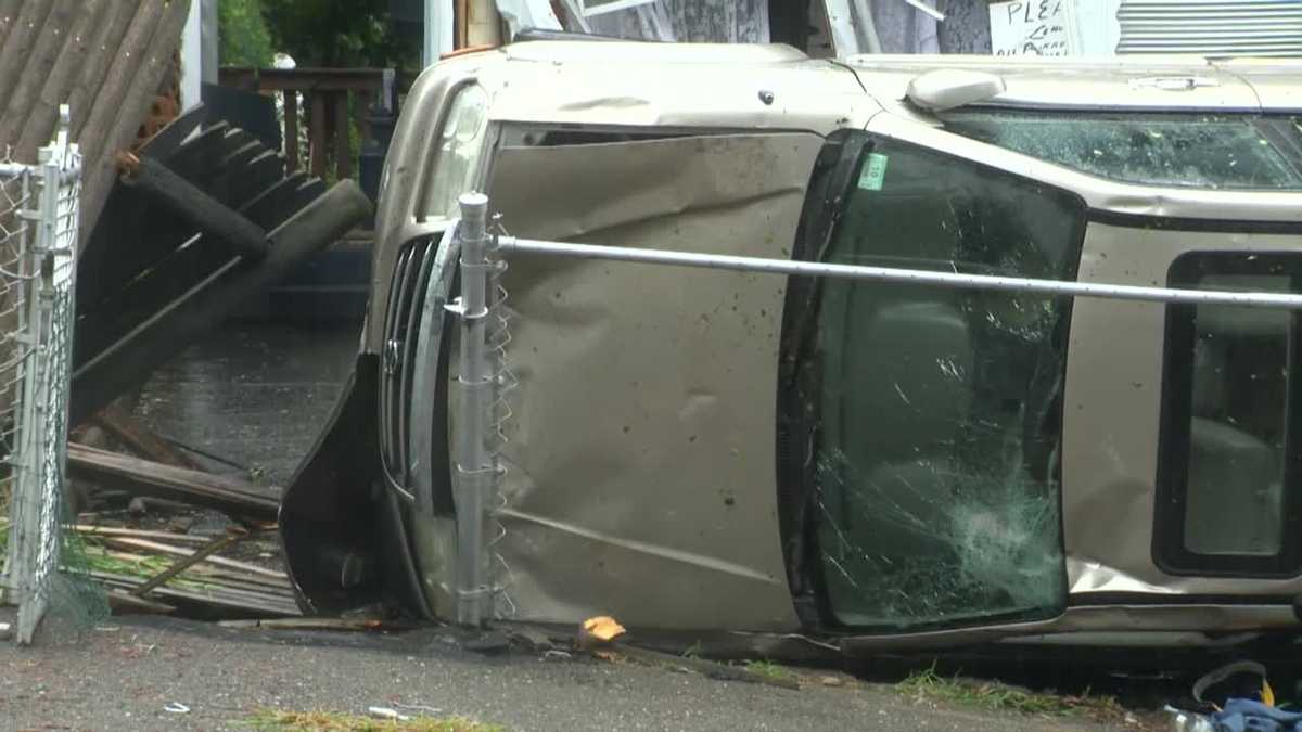 Photos: Van flips, lands in front yard of home