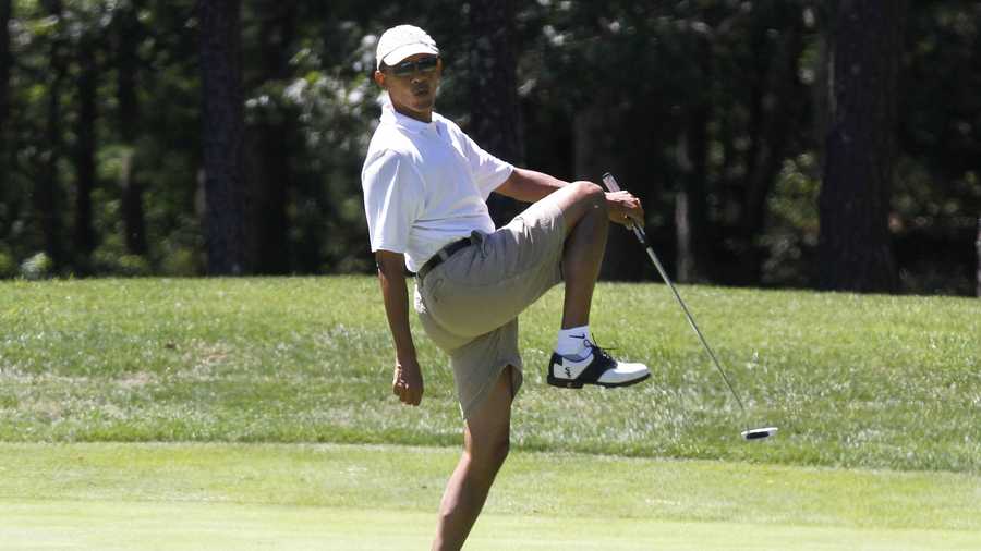 President Barack Obama reacts as he misses a shot while golfing on the first hole at Farm Neck Golf Club in Oak Bluffs, Mass., on the island of Martha's Vineyard on Sunday, Aug. 11, 2013.