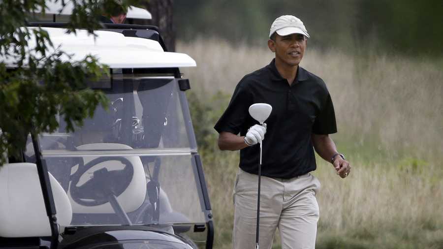 President Barack Obama prepares to tee off while golfing at Vineyard Golf Club in Edgartown, Mass., on the island of Martha's Vineyard Sunday, Aug. 18, 2013.