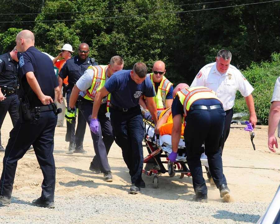 Photos Driver injured after dump truck tips over