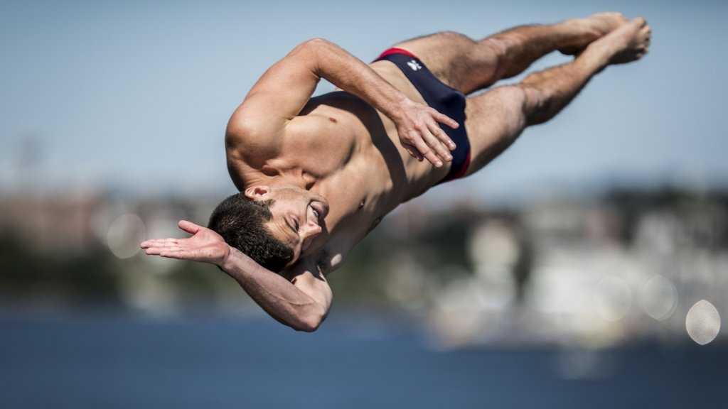Divers jump from 90 feet above Boston Harbor