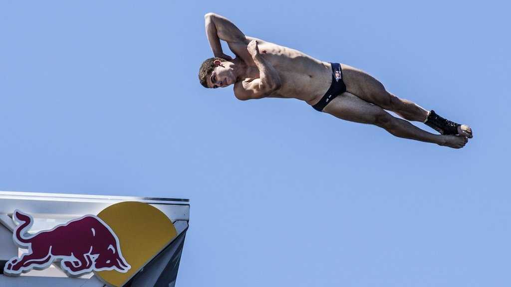Divers jump from 90 feet above Boston Harbor