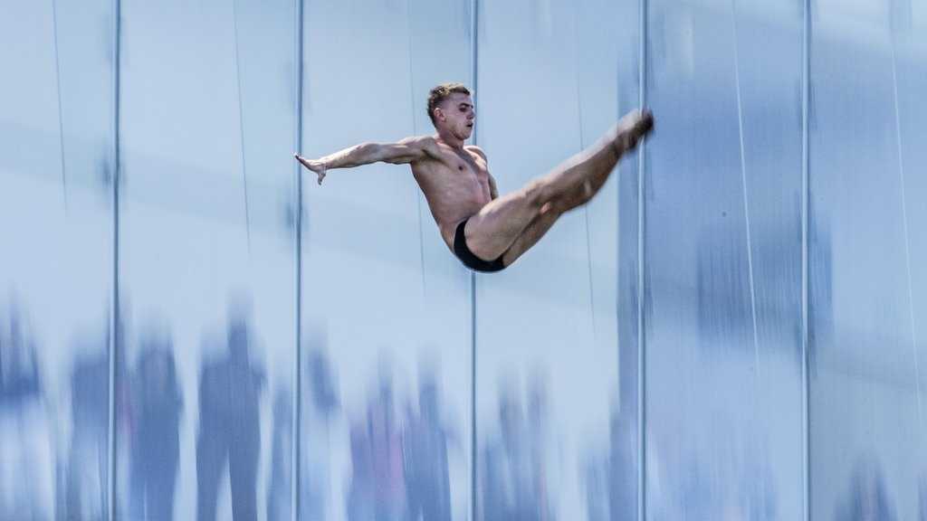 Divers jump from 90 feet above Boston Harbor
