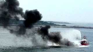 Photos: Boat catches fire in Portland Harbor