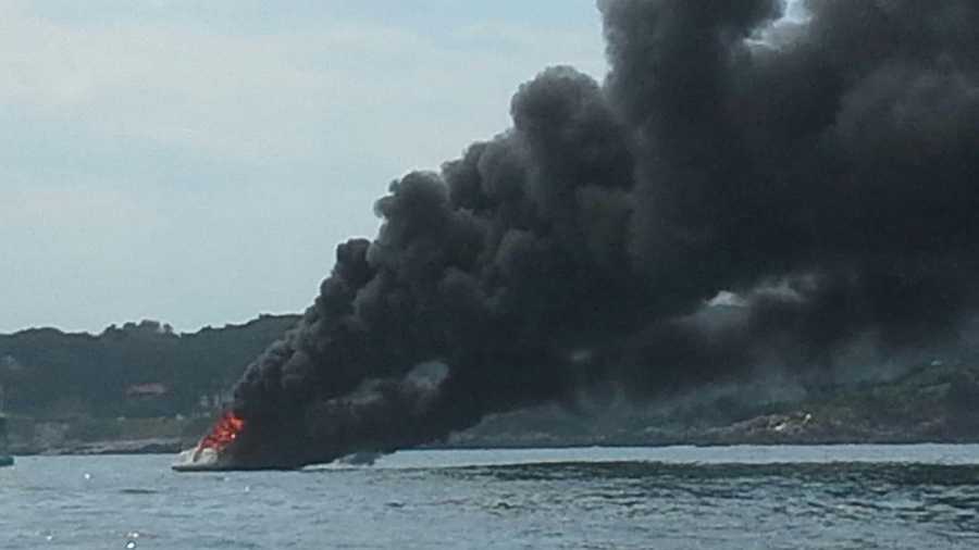 Four people were rescued on Sunday after their boat caught fire in Casco Bay.