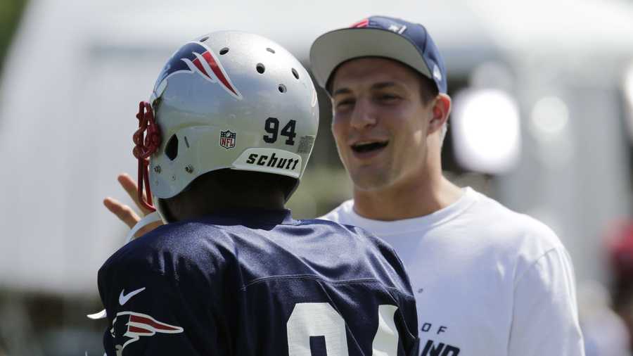 New England Patriots tight end Rob Gronkowski laughs during a team NFL football practice in Foxborough, Mass., Tuesday, July 30, 2013.