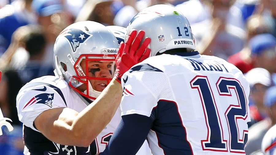 New England Patriots' Julian Edelman, left, celebrates with teammate Tom Brady, right, after catching a touchdown pass during the first half of an NFL football game against the Buffalo Bills, Sunday, Sept. 8, 2013, in Orchard Park.