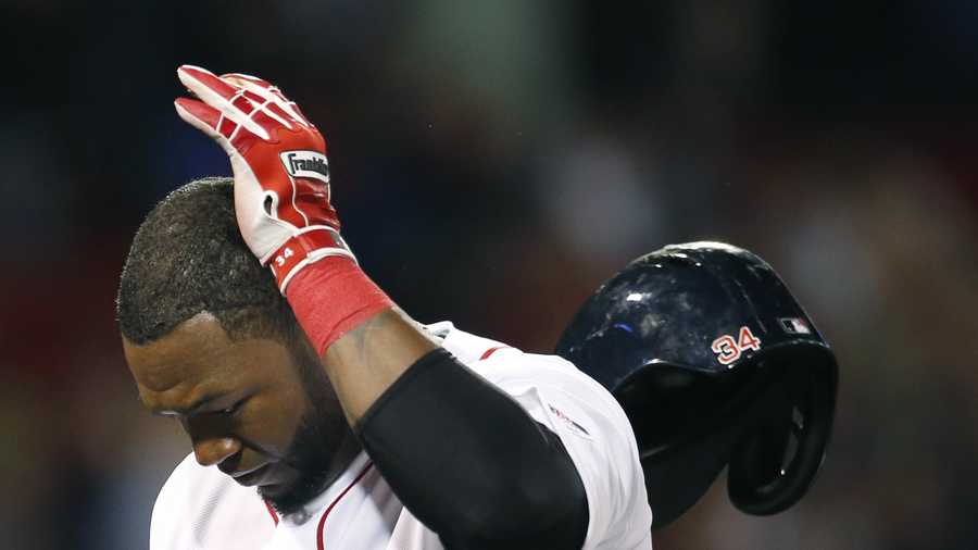 Boston Red Sox designated hitter David Ortiz tosses his helmet after making the last out in a baseball game against the Baltimore Orioles at Fenway Park in Boston, Wednesday, Sept. 18, 2013. The Orioles won 5-3 in 12 innings.