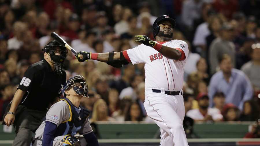 Boston Red Sox designated hitter David Ortiz watches his second home run of the game off Tampa Bay Rays starting pitcher David Price, in front of Rays catcher Jose Molina in the eighth inning in Game 2 of baseball's American League division series, Oct. 5, 2013, in Boston.