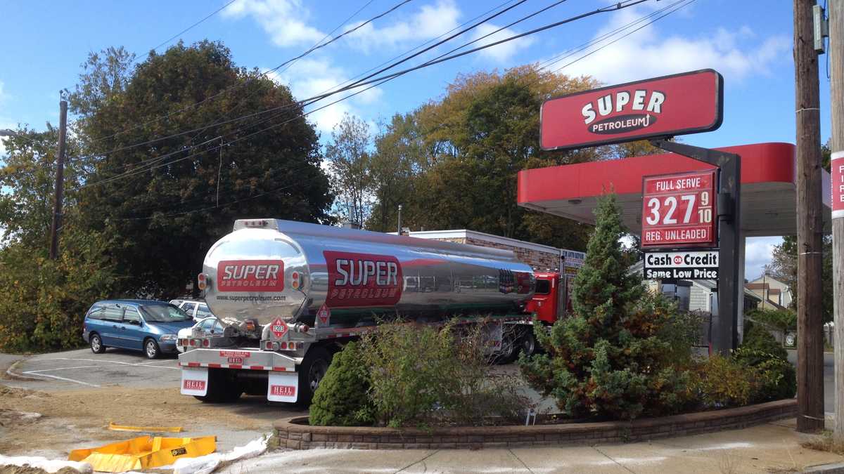 Delivery truck hits sign, spills fuel at gas station