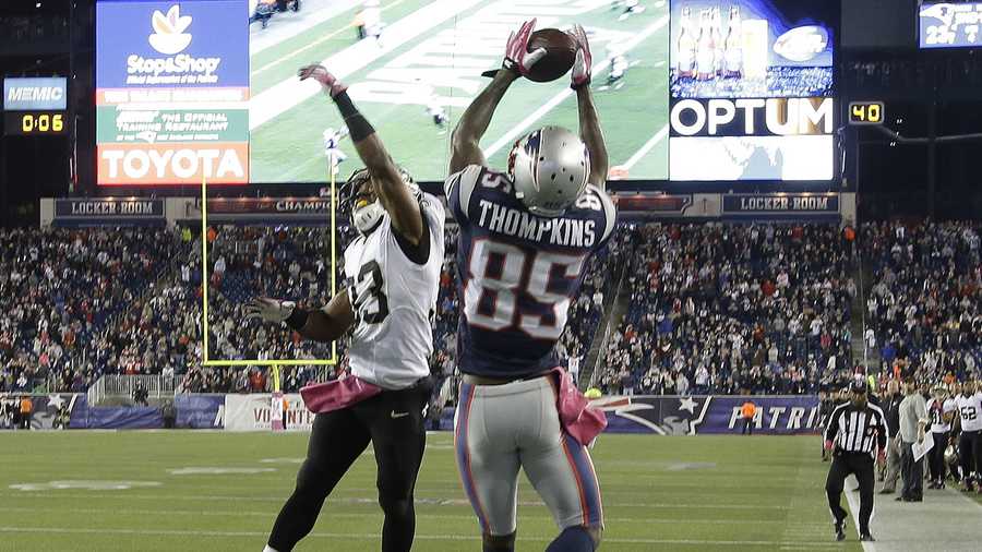 New England Patriots wide receiver Kenbrell Thompkins (85) catches the winning touchdown pass against New Orleans Saints cornerback Jabari Greer (33) in the fourth quarter of an NFL football game Sunday, Oct.13, 2013, in Foxborough, Mass. The Patriots won 30-27.