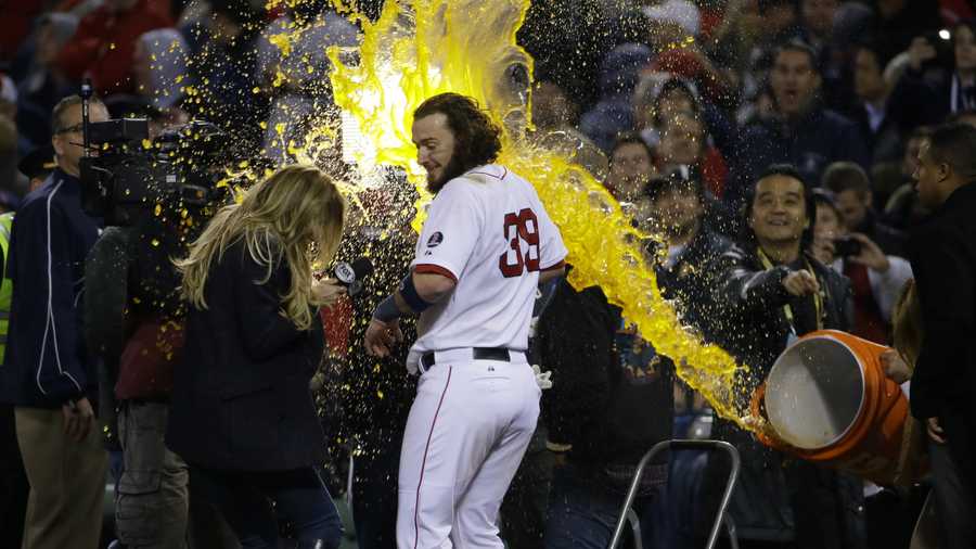 Boston Red Sox's Jarrod Saltalamacchia is  sprayed with sports drink during an interview after Game 2 of the American League baseball championship series against the Detroit Tigers Sunday, Oct. 13, 2013, in Boston. The Red Sox won 6-5.