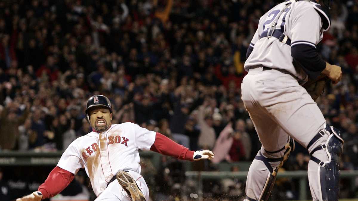 Boston Red Sox catcher Jason Varitek jumps into the arms of pitcher Keith  Foulke after the final out of game four of the World Series beating the St.  Louis Cardinals 3-0 at