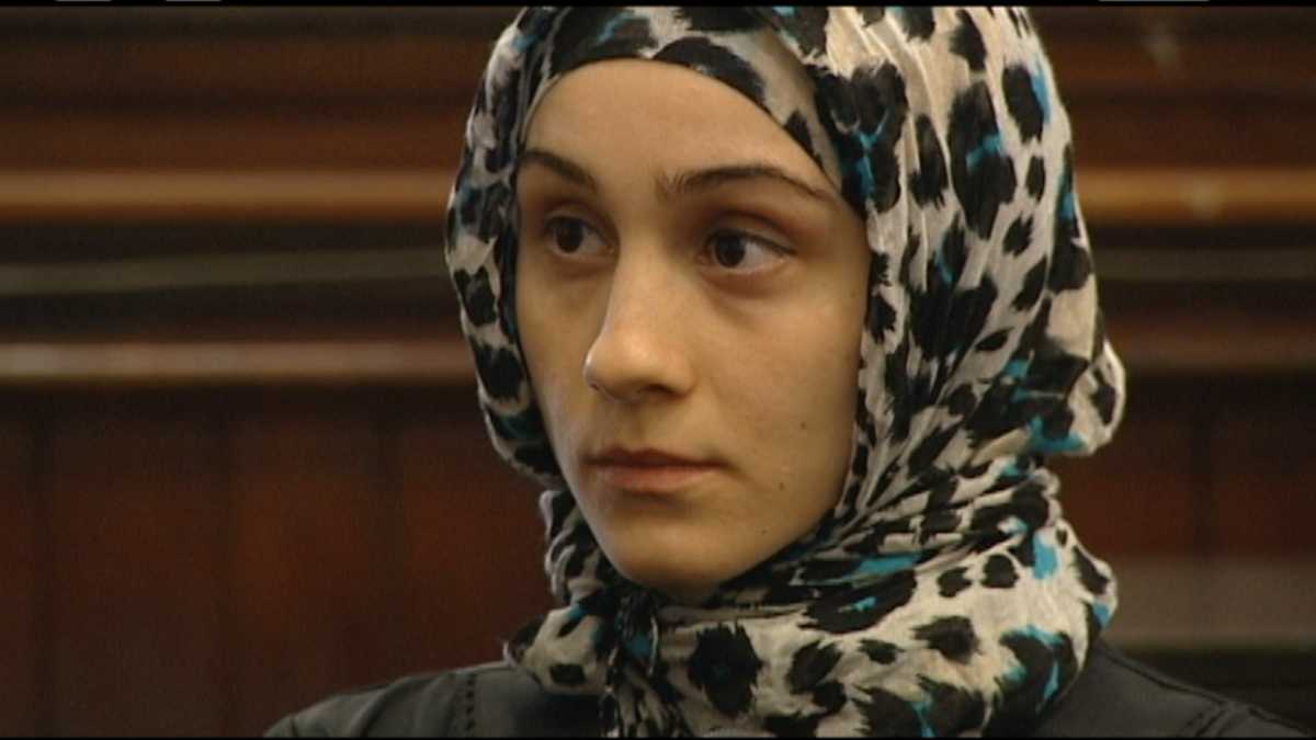 Bombing suspect's sister charged in counterfeit bill case