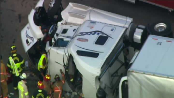 Driver rescued from tractor-trailer after crash