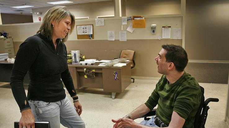 Patty Garrity chats with her brother Mark, a Weymouth native, at the Road to Responsibility work center in Braintree on Monday Oct. 7, 2013.