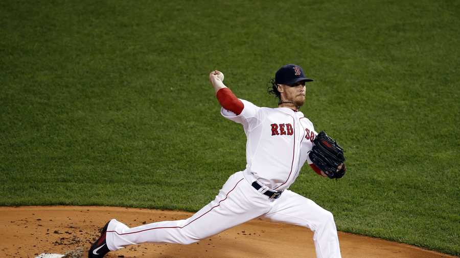 Boston Red Sox starting pitcher Clay Buchholz throws in the first inning.