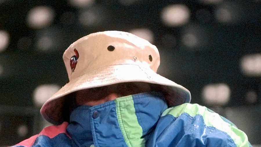 Baltna Snowden, of Wooster, Ohio, is bundled up from the cold as she waits for the start of Game 4 of the World Series at Cleveland's Jacobs Field, Wednesday, Oct. 22, 1997. Temperatures at game time were in the 30s with snow flurries.