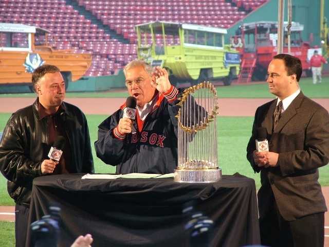 Former Boston Red Sox pitchers Curt Schilling, far right, and Keith Foulke,  holding the 2004 World Series trophy, and catcher Jason Varitek, far left,  applaud as 2004 teammate David Ortiz (34) joins