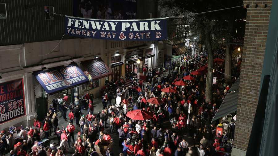 Fans make their way to Fenway Park before Game 1 of baseball's World Series between the Boston Red Sox and the St. Louis Cardinals Wednesday, Oct. 23, 2013, in Boston. 