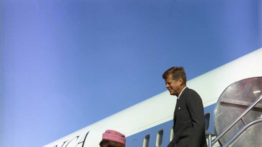 President and Mrs. Kennedy descend the stairs from Air Force One at Love Field in Dallas, Texas, 22 November 1963.