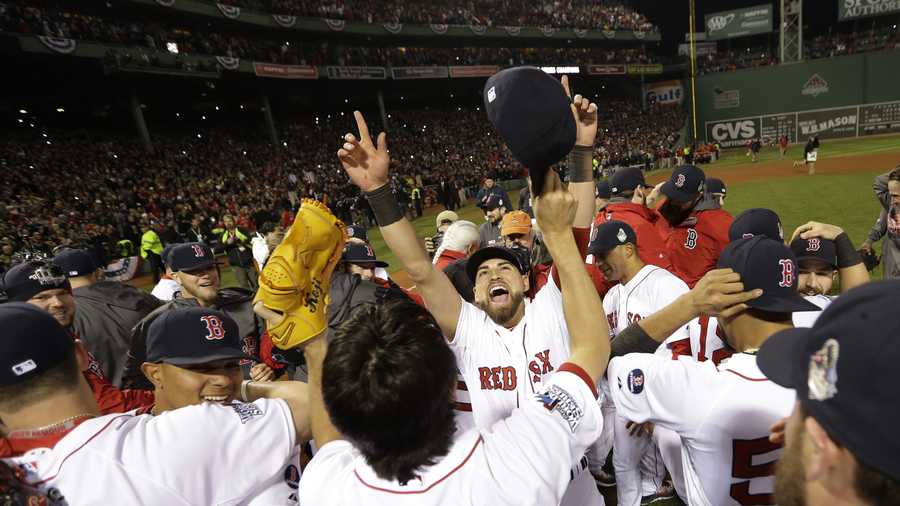 The Boston Red Sox celebrate after defeating the St. Louis Cardinals in Game 6 of baseball's World Series Wednesday, Oct. 30, 2013, in Boston. The Red Sox won 6-1 to win the series. 