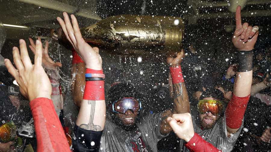 Boston Red Sox's David Ortiz celebrates with teammates after Game 6 of baseball's World Series against the St. Louis Cardinals Thursday, Oct. 31, 2013, in Boston. The Red Sox won 6-1 to win the series. Ortiz was names the series MVP.