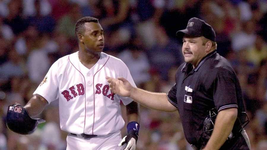 Boston Red Sox batter Jose Offerman is ejected by home plate umpire Wally Bell after arguing a strikeout in the sixth inning against the Seattle Mariners at Fenway Park in Boston, Thursday Aug. 16, 2001. 
