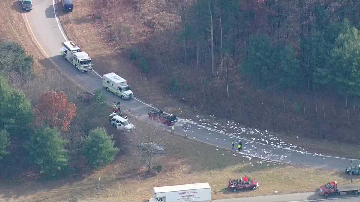 Truck flips over on highway exit ramp