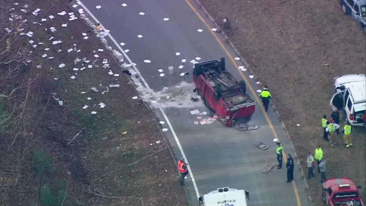 Truck flips over on highway exit ramp