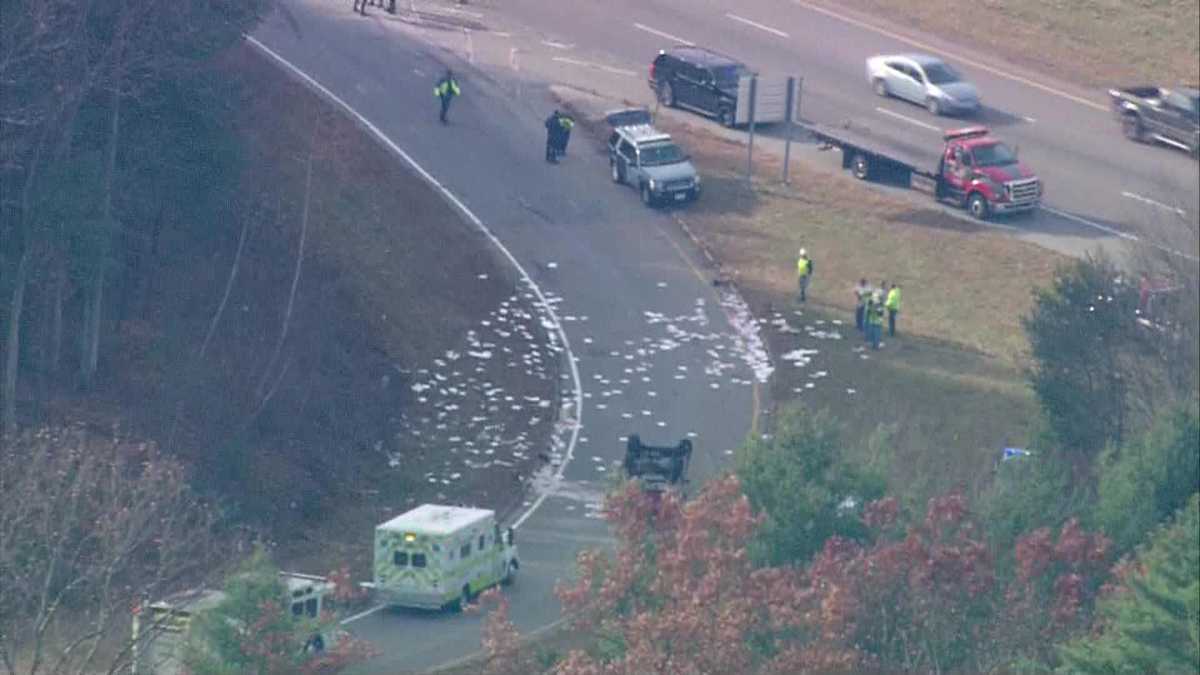 Truck flips over on highway exit ramp