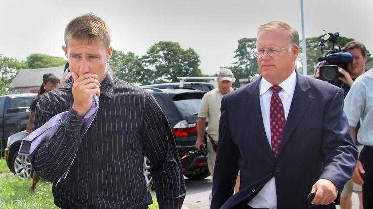 Attorney Gregory Sullivan, right, escorts client Justin McDonald, of Marshfield, as they leave Plymouth District Court, Monday, July 18, 2011. McDonald was charged in connection with boat accident that killed his friend, Steven "Zac" Woods of Marshfield.