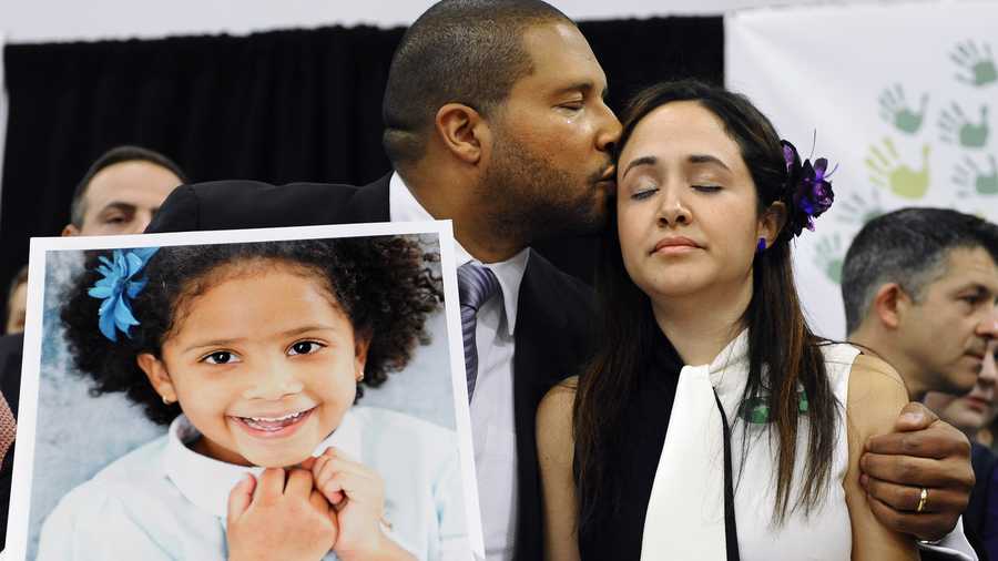 Jimmy Greene holds a portrait of his daughter Sandy Hook School shooting victim Ana Marquez-Greene on Jan. 14, 2013. One month after the mass school shooting at Sandy Hook Elementary School, the parents joined a grassroots initiative called Sandy Hook Promise to support solutions for a safer community. 