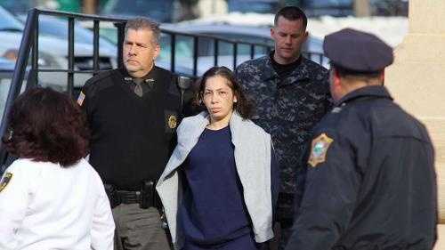 Elsa Oliver, of Fitchburg, is taken from court, Tuesday, December 24, 2013