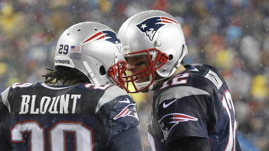 New England Patriots running back LeGarrette Blount (29) celebrates his touchdown with quarterback Tom Brady, right, in the second quarter of an NFL football game against the Buffalo Bills Sunday, Dec. 29, 2013, in Foxborough, Mass.