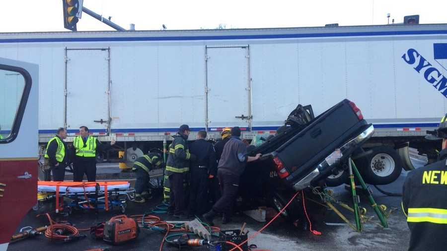 The truck was pinned under the tractor-trailer.