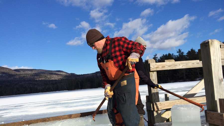 Workers cut 150-pound blocks of ice on Squam Lake.