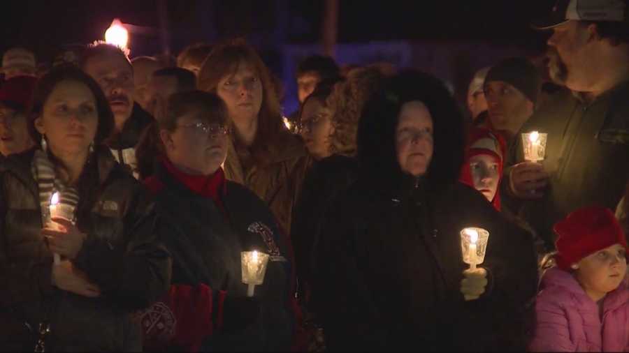 Hundreds filled the town common for a Friday night vigil to remember two young lives lost and to offer comfort to their grieving family.