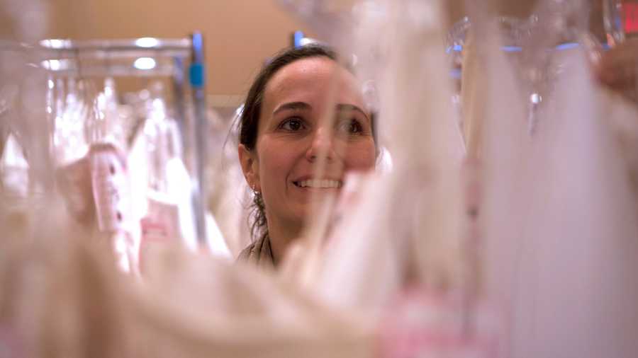 Sierra Colavito, a breast cancer researcher at Yale University as well as a bride herself, searches for gown for her wedding on July 19th. "I want my money to go to a good cause. I feel better if I can do something for breast cancer," says Colavito. 