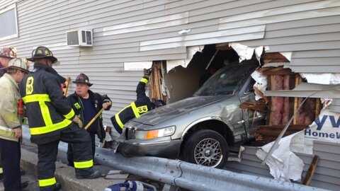 An elderly driver was taken to the hospital after he lost control of his car and crashed into a South Boston building on Saturday morning, officials said.
