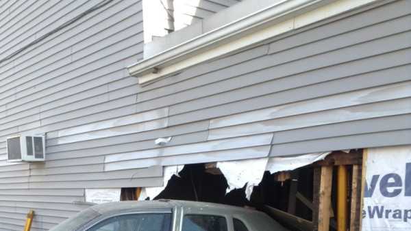Photos of car crash into building