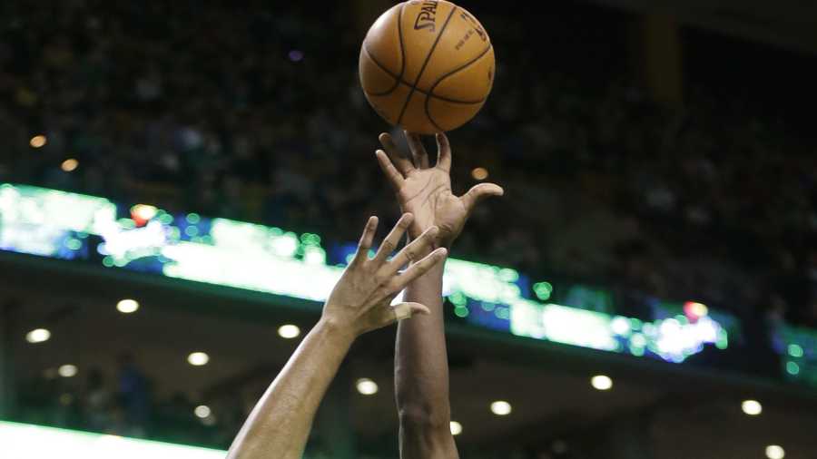 Boston Celtics forward Jeff Green (8) shoots at the basket as Orlando Magic forward Tobias Harris (12) tries to block in the first quarter of an NBA basketball game on Sunday, Feb. 2, 2014, in Boston. The Celtics won 96-89.
