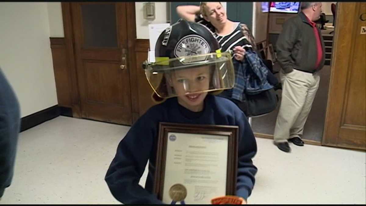 Boy, 13, honored for saving family from fire